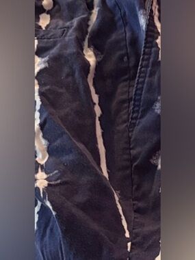 Blue and White Tie-Dye Shorts. Navy like skulls style print striped